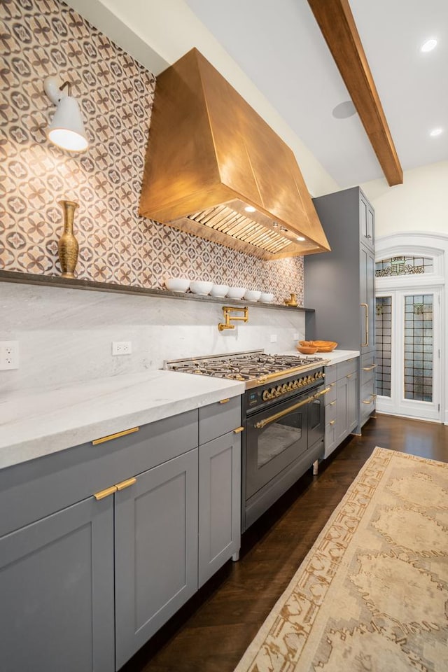 53 E Division St, Chicago, IL 60610 - kitchen with double oven range, gray cabinets, island exhaust hood, backsplash, and beam ceiling