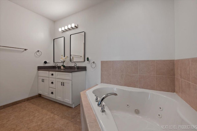 12709 Wild Rye Ct, Plainfield, IL 60585 - bathroom with double vanity, a whirlpool tub, and baseboards