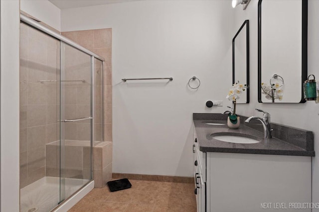 12709 Wild Rye Ct, Plainfield, IL 60585 - full bathroom featuring a stall shower, double vanity, baseboards, and tile patterned floors