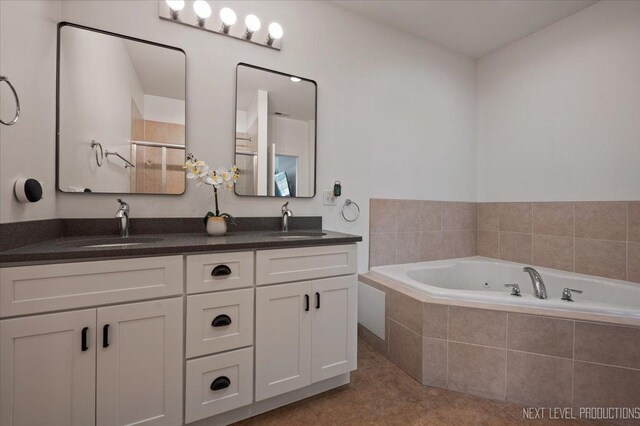12709 Wild Rye Ct, Plainfield, IL 60585 - full bath with double vanity, a tub with jets, tile patterned flooring, and a stall shower