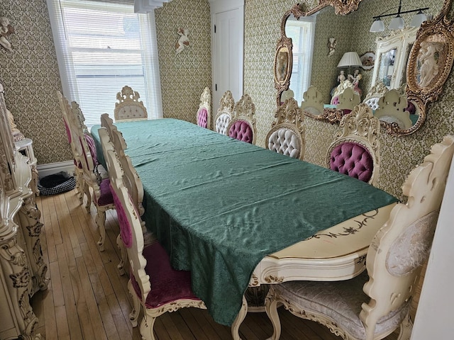 427 W Hurlbut Ave, Belvidere, IL 61008 - dining space with wood-type flooring, wallpapered walls, and baseboards