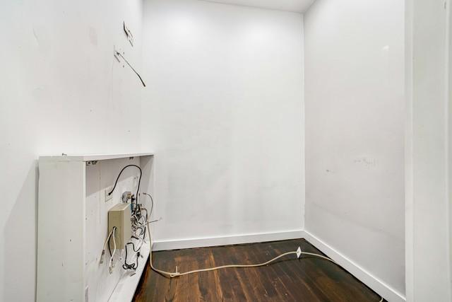 1412 W Division St Unit C-1, Chicago, IL 60642 - laundry room with wood finished floors and baseboards
