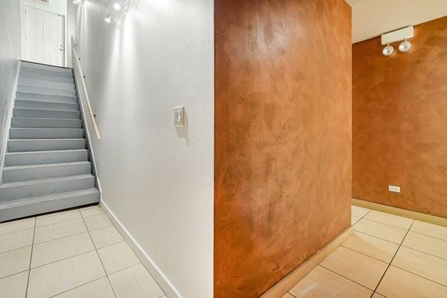 1412 W Division St Unit C-1, Chicago, IL 60642 - stairs with tile patterned flooring and baseboards