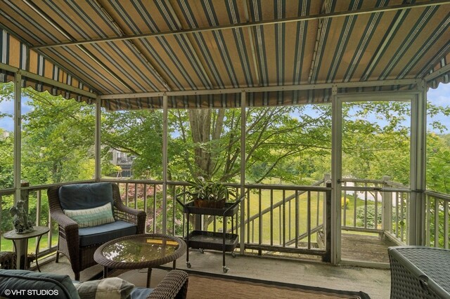 904 Warwick Ln, Lake Zurich, IL 60047 - sunroom with vaulted ceiling and view of wooded area