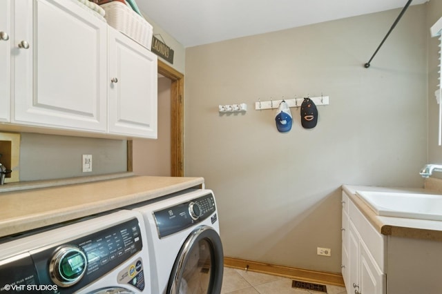 904 Warwick Ln, Lake Zurich, IL 60047 - laundry room with washer and clothes dryer, cabinet space, and light tile patterned floors