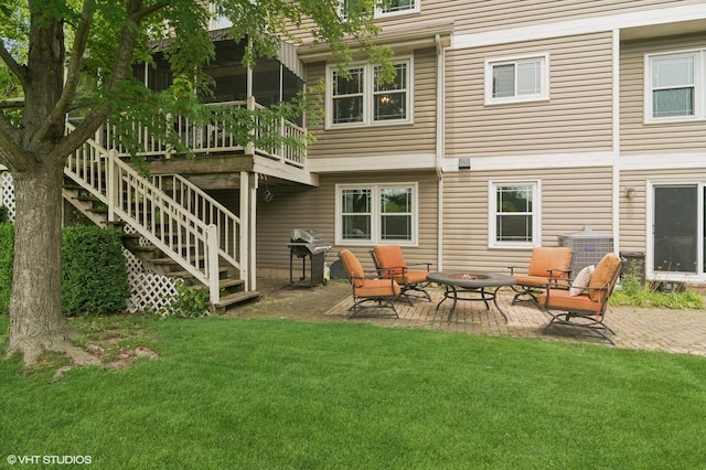 904 Warwick Ln, Lake Zurich, IL 60047 - back of property featuring an outdoor fire pit, a patio area, a lawn, and a wooden deck