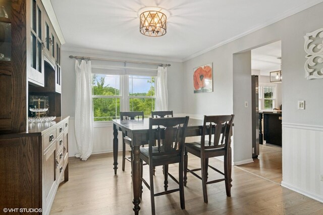 904 Warwick Ln, Lake Zurich, IL 60047 - dining space with a chandelier, light wood finished floors, and ornamental molding