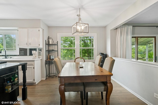 904 Warwick Ln, Lake Zurich, IL 60047 - dining area featuring wood finished floors and a chandelier