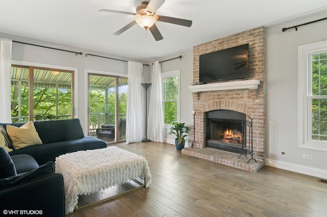 904 Warwick Ln, Lake Zurich, IL 60047 - living room featuring ceiling fan, a brick fireplace, and wood-type flooring