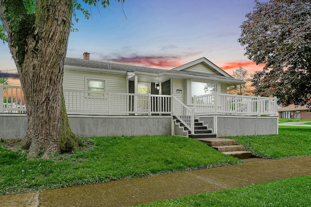 301 W Graham Ave, Lombard, IL 60148 - view of front of home with a chimney, a front lawn, stairway, covered porch, and roof with shingles