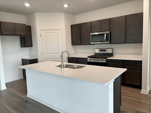 2520 Redwood Trl, Wonder Lake, IL 60097 - kitchen featuring appliances with stainless steel finishes, a sink, dark wood-type flooring, dark brown cabinets, and recessed lighting