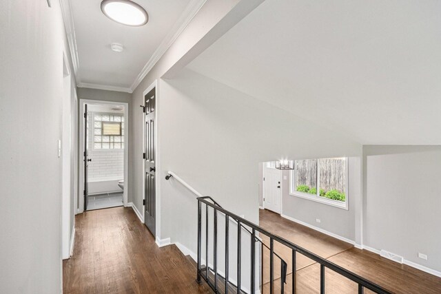 329 E Jefferson St, Bensenville, IL 60106 - corridor featuring wood finished floors, ornamental molding, baseboards, and an upstairs landing