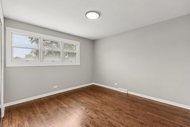 329 E Jefferson St, Bensenville, IL 60106 - empty room with dark wood finished floors and baseboards