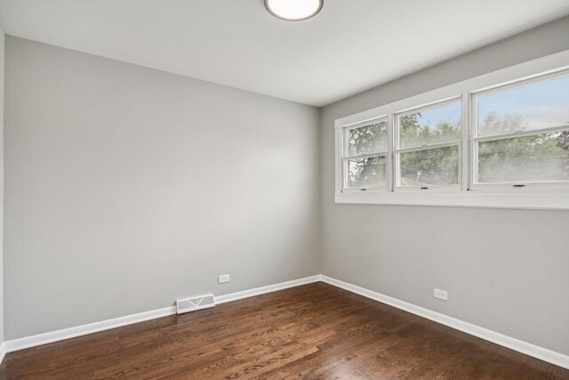 329 E Jefferson St, Bensenville, IL 60106 - empty room featuring baseboards and dark wood-style floors