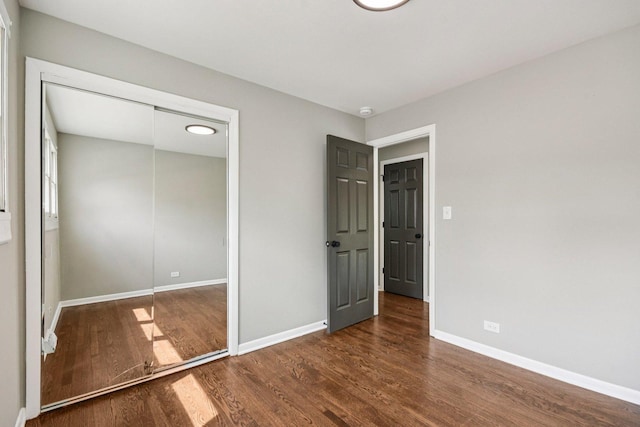329 E Jefferson St, Bensenville, IL 60106 - unfurnished bedroom with wood finished floors, baseboards, and a closet