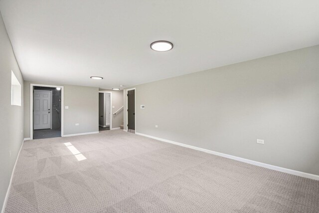 329 E Jefferson St, Bensenville, IL 60106 - unfurnished room featuring light colored carpet, baseboards, and stairs
