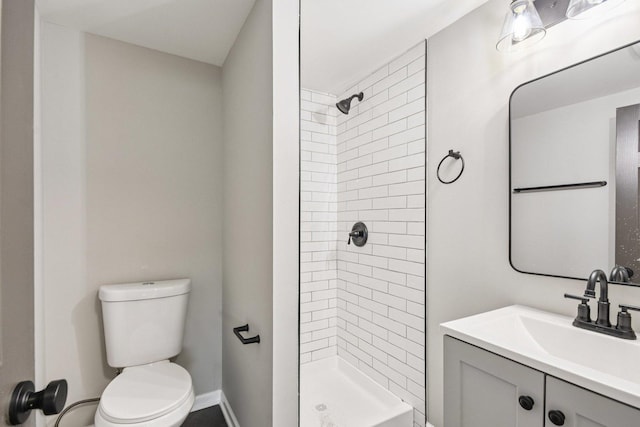 329 E Jefferson St, Bensenville, IL 60106 - full bathroom featuring toilet, a stall shower, vanity, and baseboards