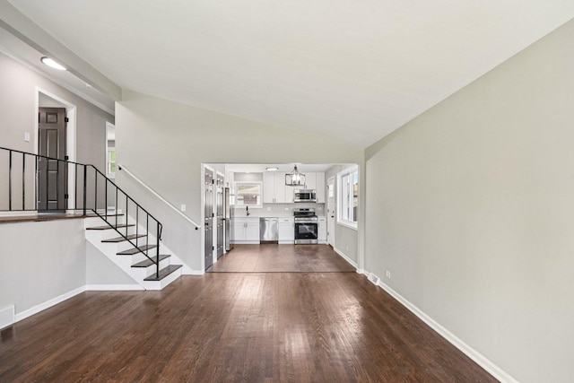 329 E Jefferson St, Bensenville, IL 60106 - unfurnished living room with stairs, dark wood finished floors, baseboards, lofted ceiling, and recessed lighting