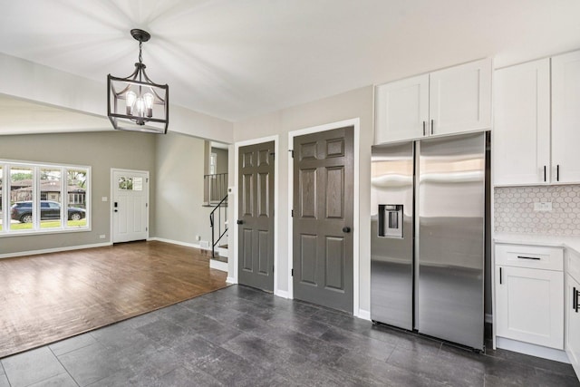 329 E Jefferson St, Bensenville, IL 60106 - kitchen with stainless steel fridge, backsplash, white cabinetry, and a chandelier
