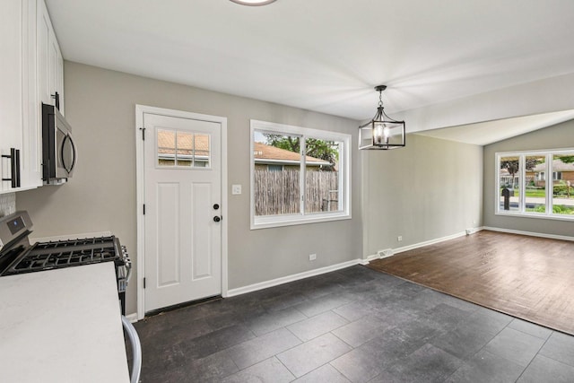 329 E Jefferson St, Bensenville, IL 60106 - unfurnished dining area featuring healthy amount of natural light, a chandelier, and baseboards