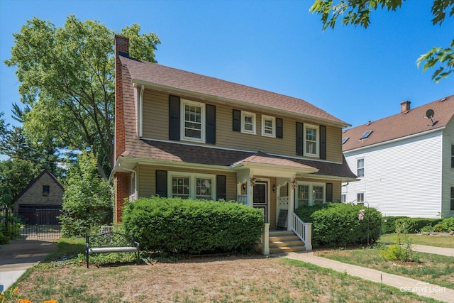 1044 Garfield Ave, Aurora, IL 60506 - view of front of house featuring a porch, a chimney, and a shingled roof