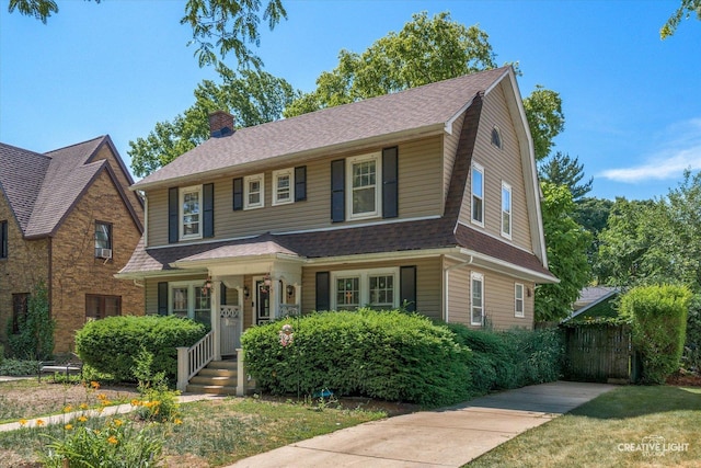 1044 Garfield Ave, Aurora, IL 60506 - view of front of property with a chimney, roof with shingles, and covered porch