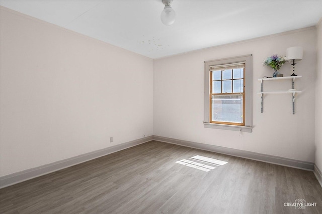 1044 Garfield Ave, Aurora, IL 60506 - empty room with wood finished floors and baseboards