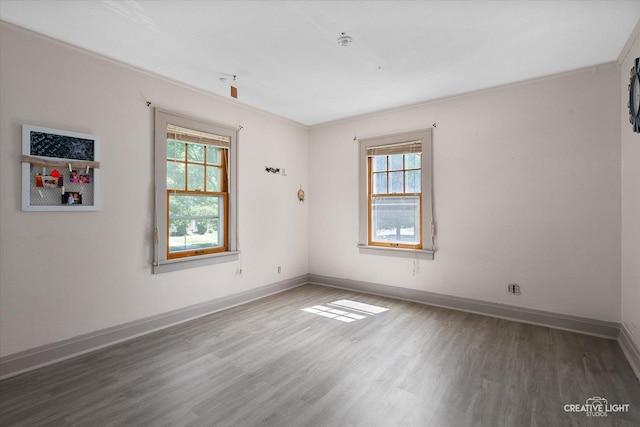 1044 Garfield Ave, Aurora, IL 60506 - unfurnished room featuring wood finished floors and baseboards