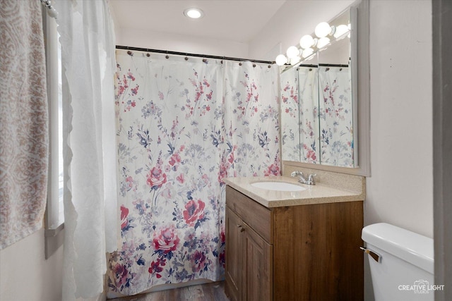 1044 Garfield Ave, Aurora, IL 60506 - bathroom with vanity, wood finished floors, and recessed lighting