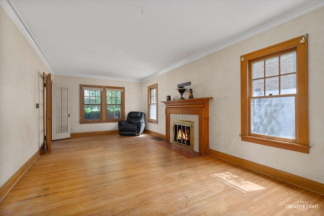 1044 Garfield Ave, Aurora, IL 60506 - living area with light wood-style floors, ornamental molding, and a fireplace