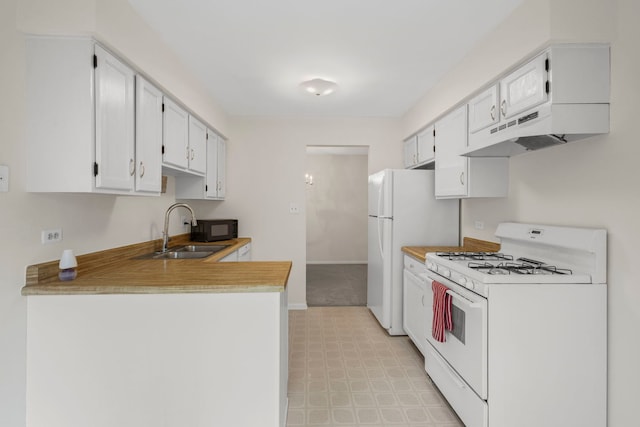 913 Knottingham Dr Unit 2A, Schaumburg, IL 60193 - kitchen with white appliances, a sink, light floors, under cabinet range hood, and a peninsula