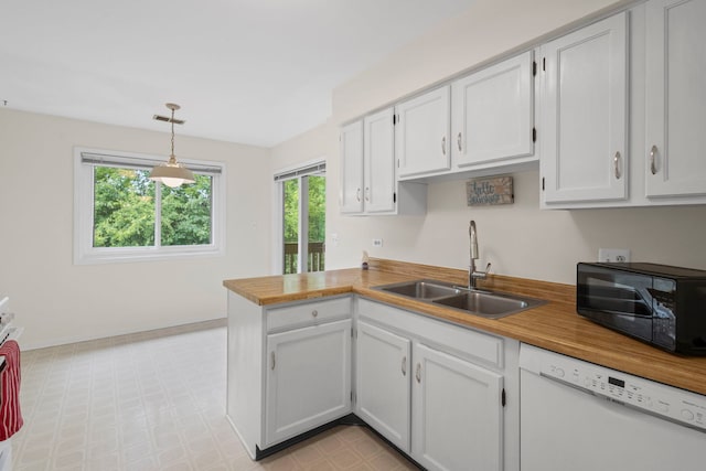 913 Knottingham Dr Unit 2A, Schaumburg, IL 60193 - kitchen with white dishwasher, a sink, black microwave, and healthy amount of natural light