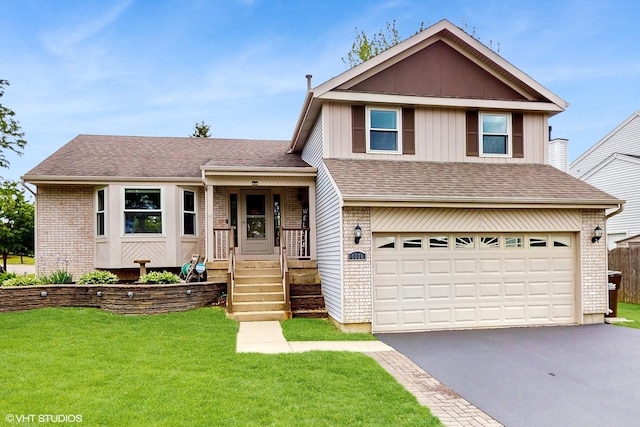 1176 Westport Rdg, Crystal Lake, IL 60014 - view of front of house featuring an attached garage, driveway, brick siding, a front lawn, and a shingled roof