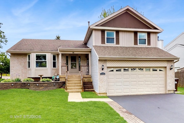 1176 Westport Rdg, Crystal Lake, IL 60014 - view of front of property with a garage, brick siding, driveway, a front yard, and a shingled roof