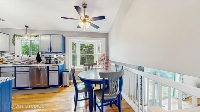 1176 Westport Rdg, Crystal Lake, IL 60014 - kitchen featuring stainless steel dishwasher, plenty of natural light, ceiling fan, light wood finished floors, and lofted ceiling