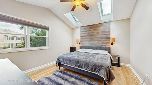 1176 Westport Rdg, Crystal Lake, IL 60014 - bedroom with a skylight, wood finished floors, baseboards, lofted ceiling, and a ceiling fan