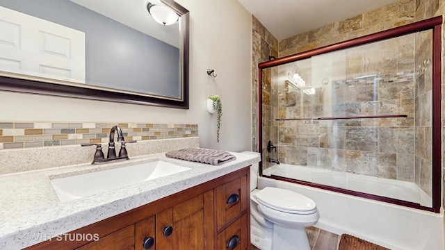 1176 Westport Rdg, Crystal Lake, IL 60014 - full bathroom featuring toilet, vanity, shower / bath combination with glass door, wood finished floors, and decorative backsplash
