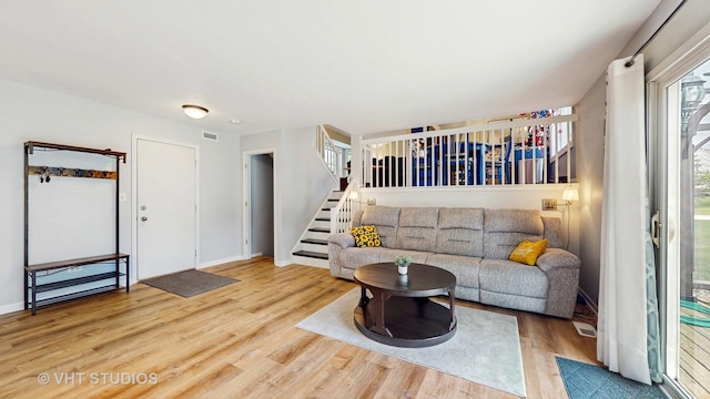 1176 Westport Rdg, Crystal Lake, IL 60014 - living area featuring wood finished floors, stairway, and baseboards