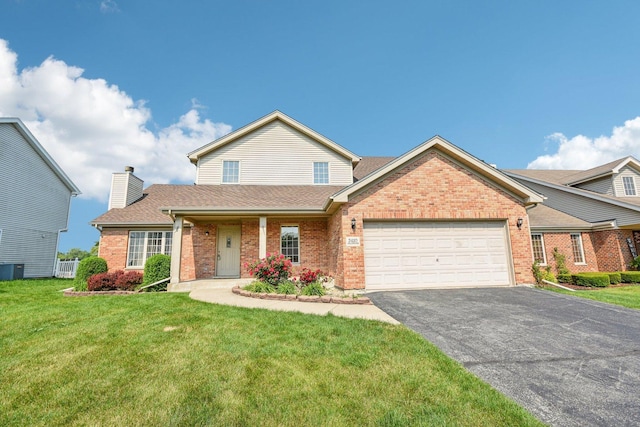 3410 Beckwith Ln, Crete, IL 60417 - traditional home featuring brick siding, an attached garage, driveway, and a front lawn