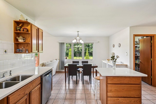 3410 Beckwith Ln, Crete, IL 60417 - kitchen featuring stainless steel dishwasher, open shelves, a chandelier, light countertops, and tasteful backsplash