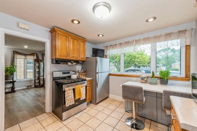 3528 Ernst St, Franklin Park, IL 60131 - kitchen with stainless steel appliances, light countertops, plenty of natural light, and recessed lighting