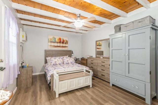 3528 Ernst St, Franklin Park, IL 60131 - bedroom featuring light wood-style flooring, baseboards, wooden ceiling with exposed beams, and a ceiling fan