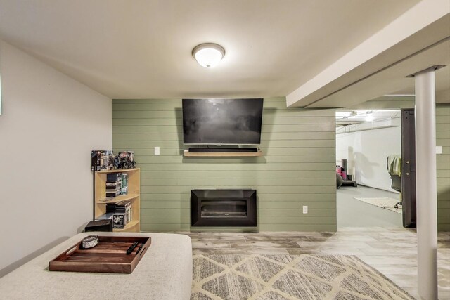 1086 E Thacker St, Des Plaines, IL 60016 - living room featuring wood walls, a large fireplace, and wood finished floors