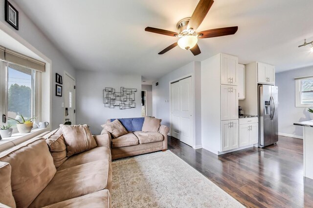 1086 E Thacker St, Des Plaines, IL 60016 - living area featuring dark wood-style floors, ceiling fan, and baseboards
