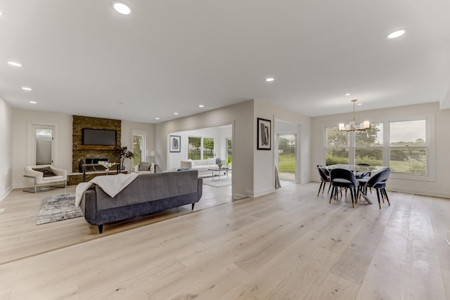 13045 Silver Fox Dr, Lemont, IL 60439 - living room with a chandelier, light wood-style flooring, baseboards, and recessed lighting
