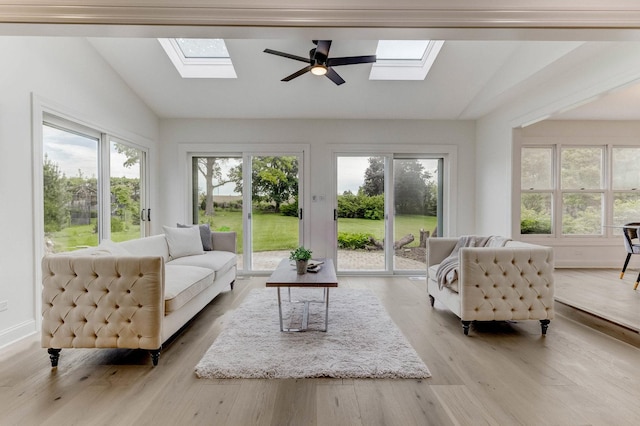 13045 Silver Fox Dr, Lemont, IL 60439 - living room featuring a skylight, vaulted ceiling, plenty of natural light, wood finished floors, and ceiling fan