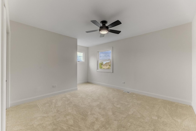 13045 Silver Fox Dr, Lemont, IL 60439 - spare room featuring carpet, a ceiling fan, and baseboards