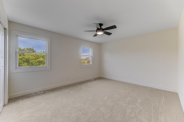 13045 Silver Fox Dr, Lemont, IL 60439 - unfurnished room with carpet flooring, a ceiling fan, and baseboards