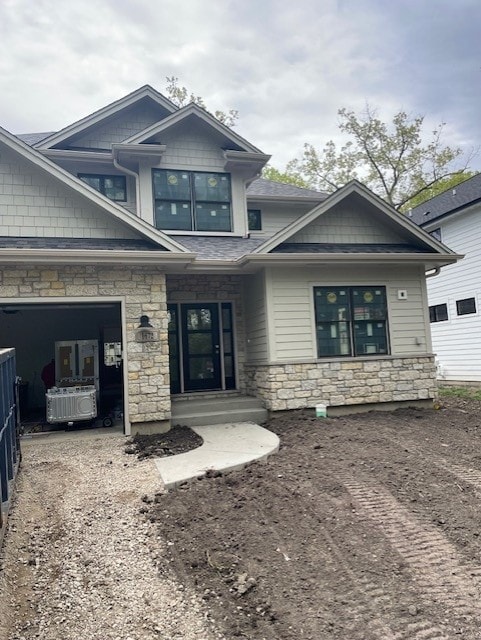 1672 Huntington Ln, Highland Park, IL 60035 - view of front of house with stone siding and dirt driveway