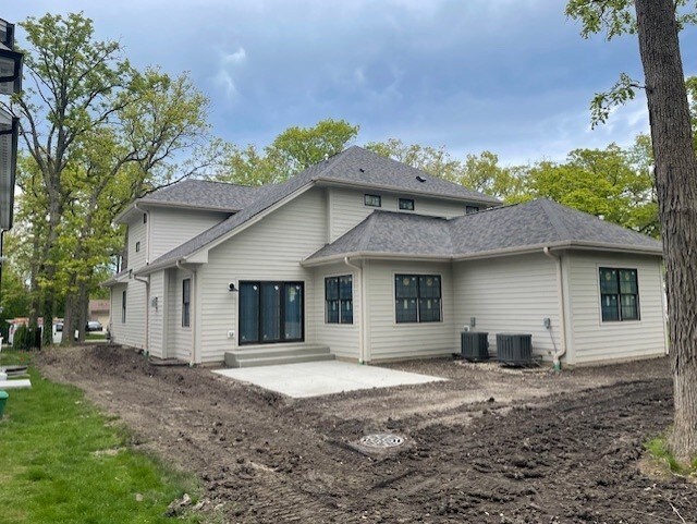 1672 Huntington Ln, Highland Park, IL 60035 - rear view of house with a patio and central AC unit